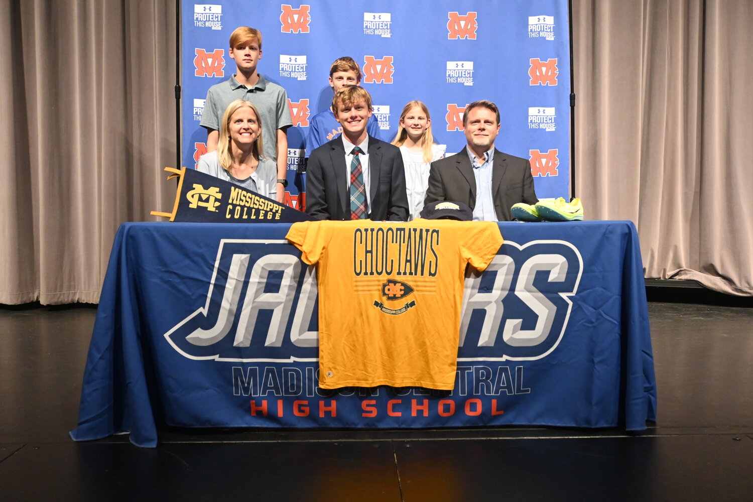 Madison Central High School senior Colin Brannon signed a national letter of intent to run cross country and track at Mississippi College. Seated left to right are Jennifer Brannon (mom), Brannon, and Jeff Brannon (dad). Standing left to right are Drew Brannon (brother), Evan Brannon (brother), and Kate Brannon (sister).